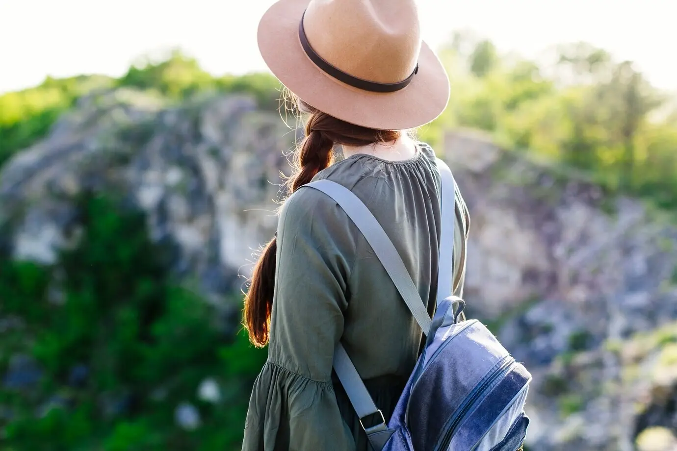 Rear view of a tourist in a rocky landscape