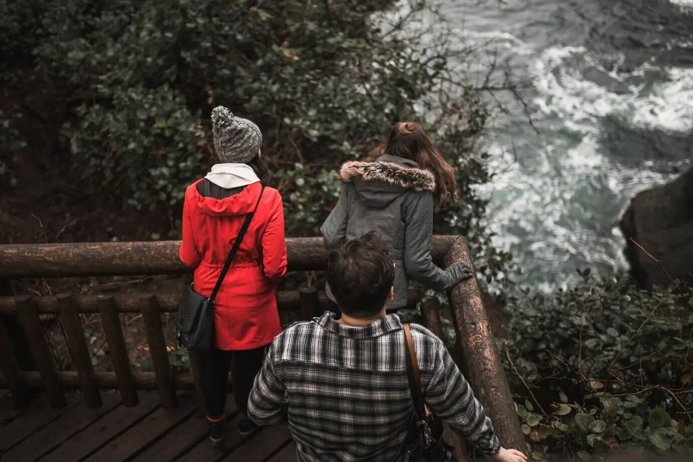 An unrecognizable family taking in the view.